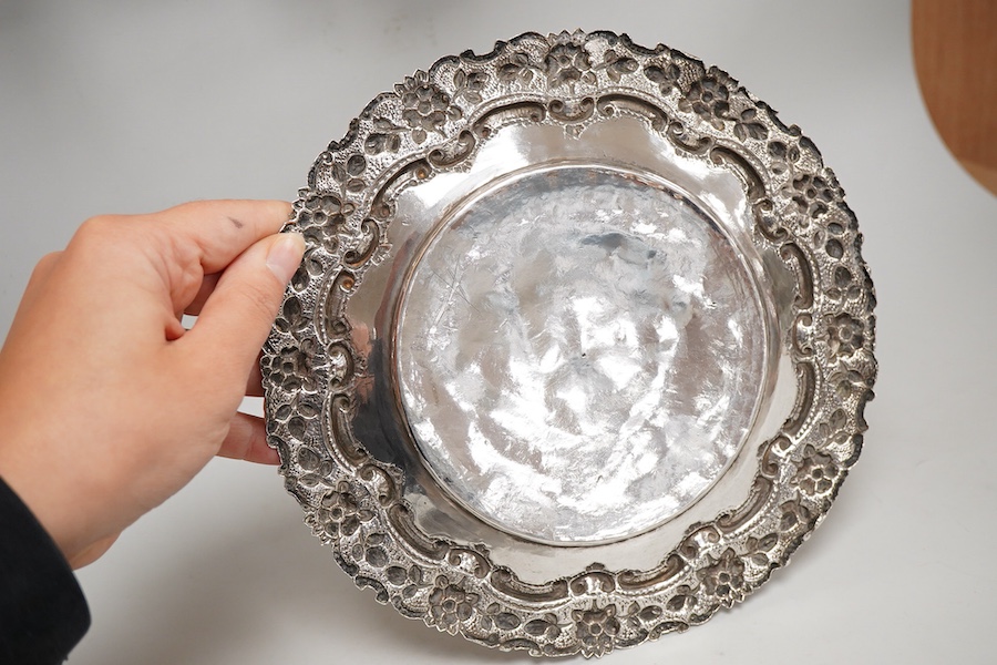 Two Indian white metal rose bowls, one octagonal with stand, diameter 12.5cm, together with a small white metal stand, with foliate border.